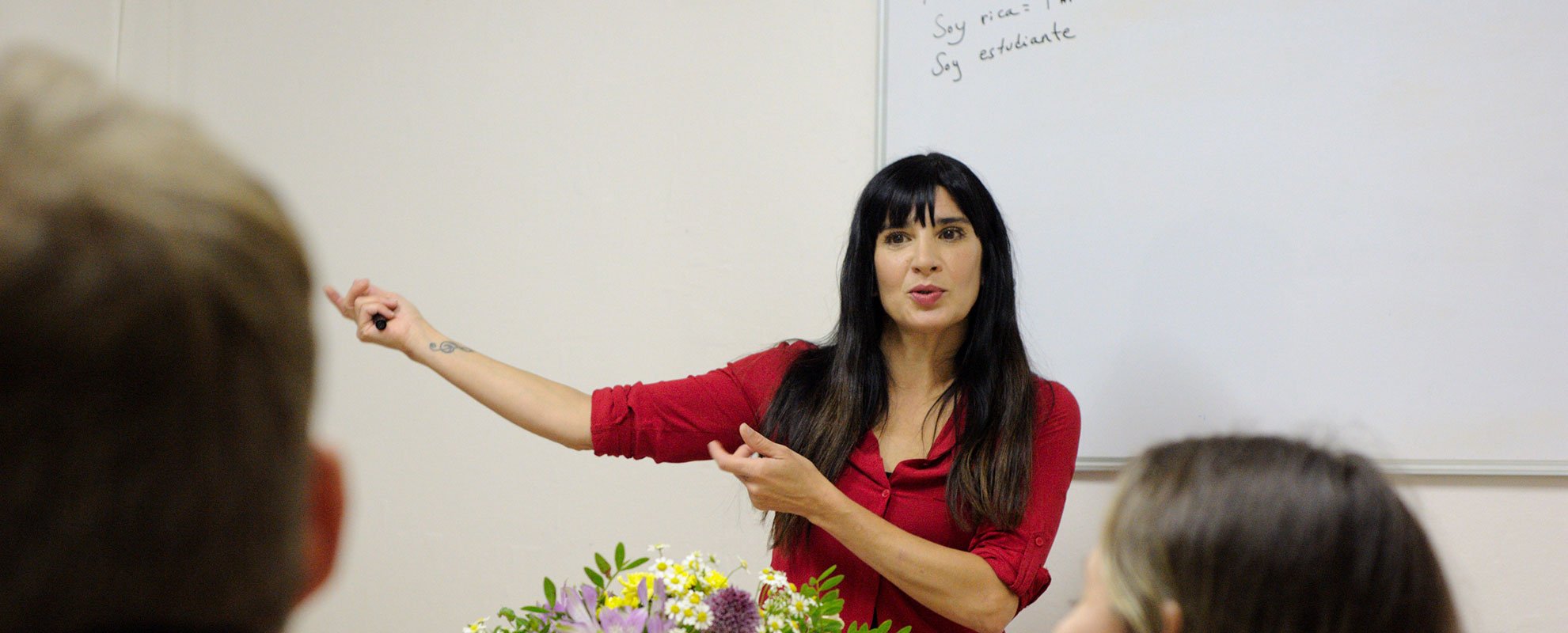 A Spanish Native-speaking teacher teaching a lesson at language Atelier School