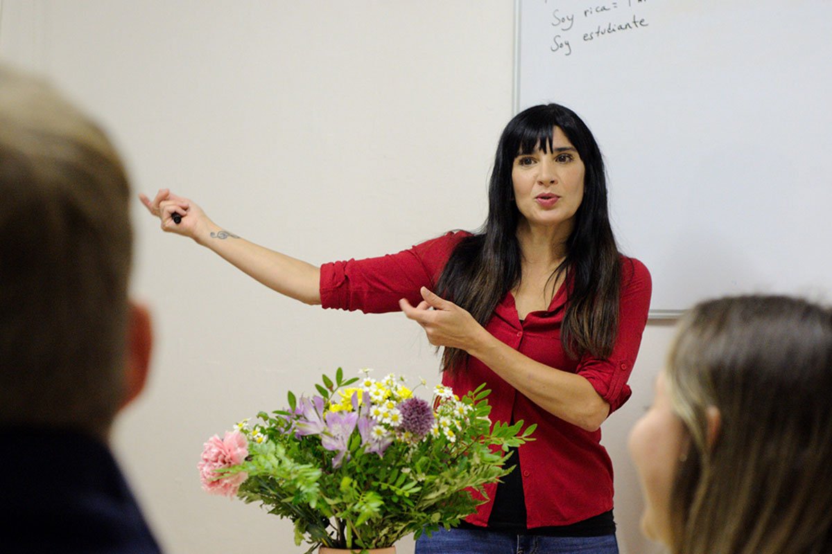 A Spanish Native-speaking teacher teaching a lesson at language Atelier School