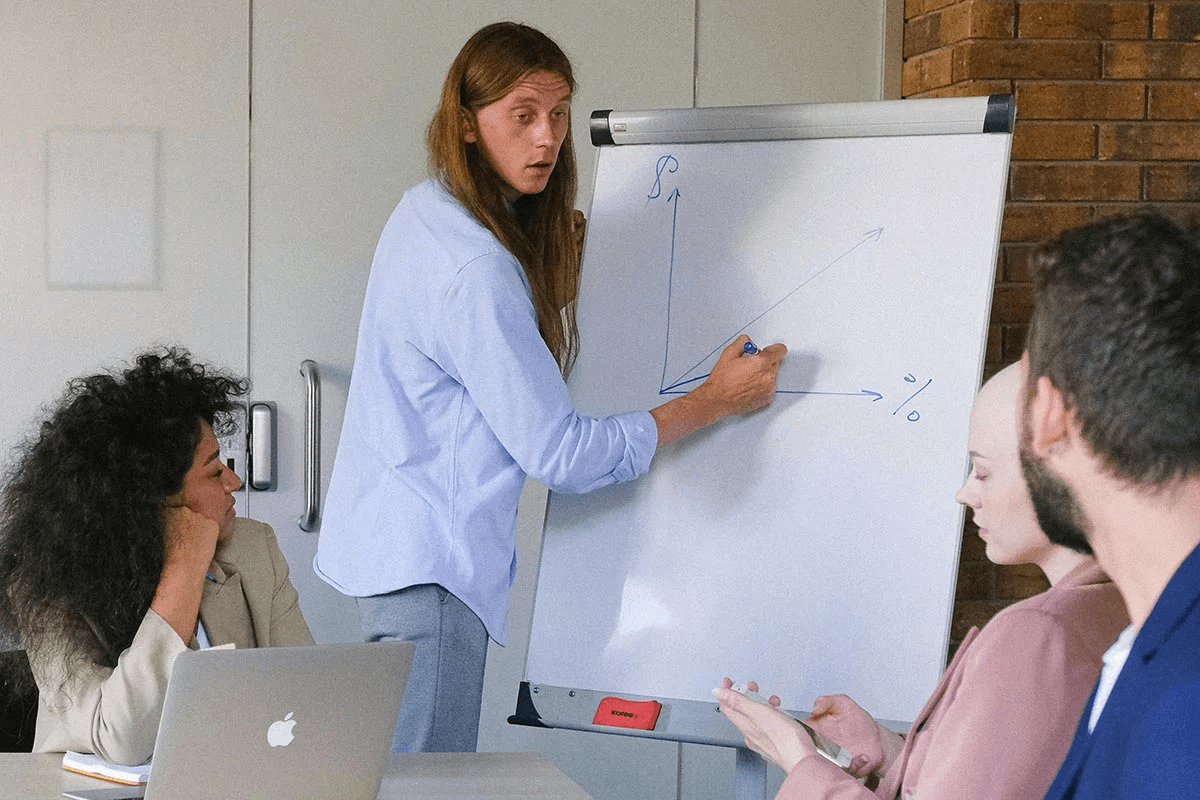 Teacher explaining language lesson to students